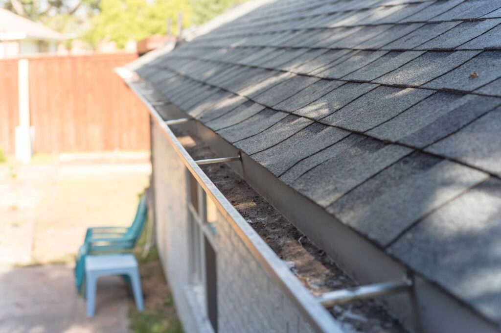 maintain clean gutters to prevent roof algae and mold